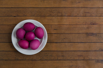 Easter eggs on a wooden background.