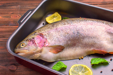 raw trout in baking dish