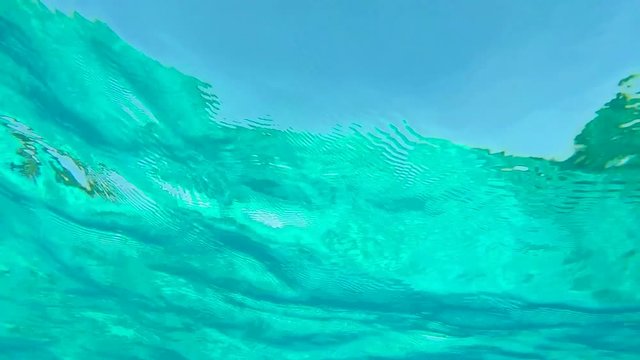 Underwater View Thru Amazing Clear Blue Sea Water. HD GoPro Slowmotion Background.