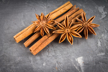 star anise and cinnamon on the gray background