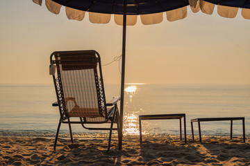 Beach chair and beach umbrella, Sunrise and sea landscape  nature background.
