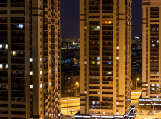 Fototapeta na wymiar Night view of new modern skyscrapers in yellow tones, new business centres 