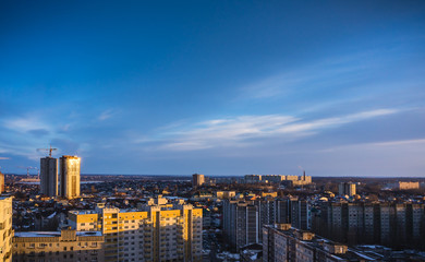 Aerial evening cityscape from rooftop of Voronezh. Houses, sunset, sky, clouds, 