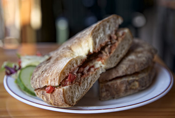 Traditional maltese dish - ftira. Malta food. Typical Maltese bread called ftira accompanied by...