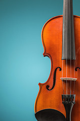 The violin front view on blue © master1305