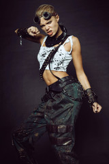 Young woman in brutal futuristic clothes