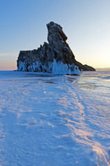 Small Ogoi island on Baikal lake is famous for bizarre rock formation. Ice covers Baikal water till winter.