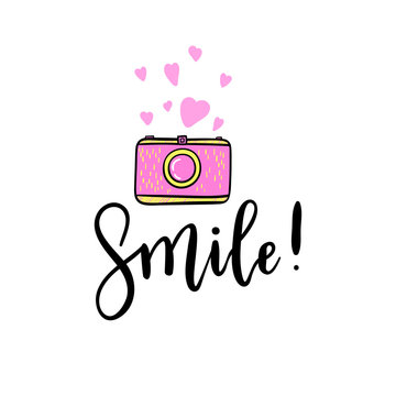 Smile hand lettering with pink retro photo camera, hearts sticker. Vector cute emoji illustration.