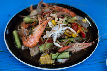 Mixed papaya salad put everything shrimp, crab, squid, Sausage.