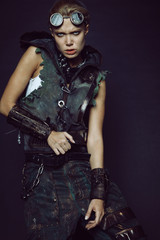 Young woman in brutal futuristic clothes