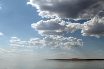 the sky reflected in the water, deserted beach lake, summer sky, nature, blue cloud,