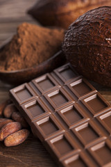 Cocoa pod and chocolate bar and food dessert background