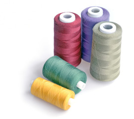 threads for sewing of various colors on a white background isolated background