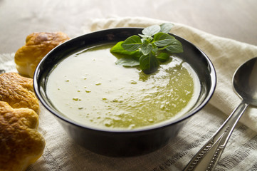 Green pea soup in bowl