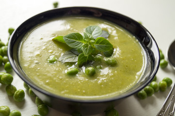 Green pea soup in bowl