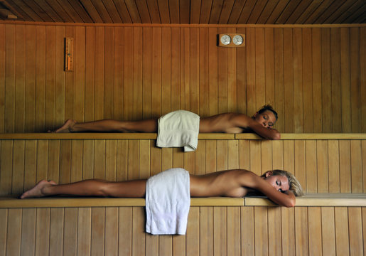 two beautiful women  relaxing in spa sauna