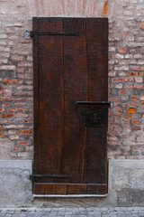 Vintage Italian wooden door. Tuscany, Italy