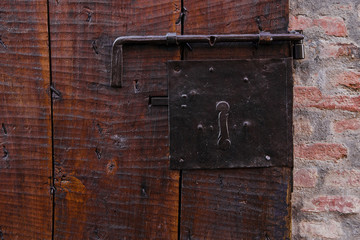 Close-up image of ancient wooden doors. Rough wooden surface
