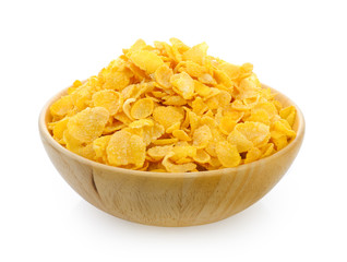 corn flakes in wood bowl isolated on white background