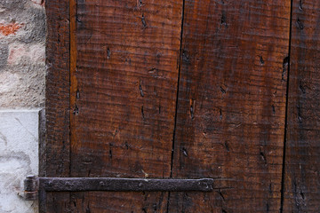 Fragment of ancient wooden door. Vintage tone of texture