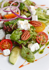 green salad with avocado, pesto sauce and mozzarella