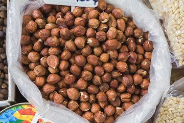 Heap of peeled hazelnuts at street market