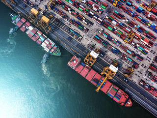 container ship in import export and business logistic.By crane ,Trade Port , Shipping.cargo to harbor.Aerial view.Water transport.International.Shell Marine.Top view. - obrazy, fototapety, plakaty