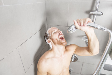 Handsome man in shower