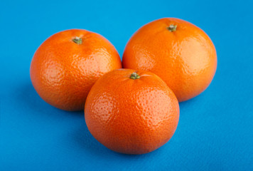 Ripe mandarin close-up on a white background. Tangerine orange. Colorful Food and drink still life concept. Fresh fruits and vegetables on color background. Clementine. Citrus. Fresh fruits. Diet.