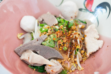 Thai Fusion Food, dry noodle with pork in ceramic bowl