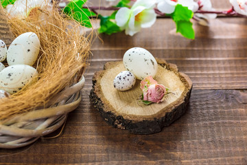 Beautiful Easter eggs with flowers on the wooden background