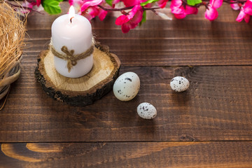 Beautiful Easter eggs with flowers on the wooden background