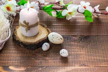 Beautiful Easter eggs with flowers on the wooden background