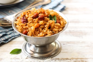 Tamarind Poha / Puli Aval - South Indian breakfast with flattened rice, selective focus