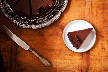 Chocolate cake on wooden table, directly above
