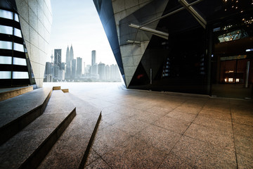 Empty marble stair and floor front of modern polygon design buildings.