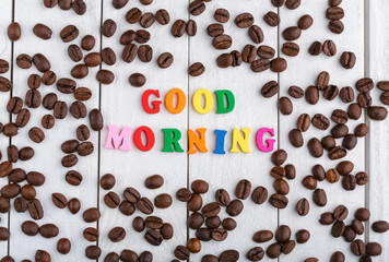 Coffee beans. Good morning. Roasted coffee beans background close up. Coffee beans pile from top with copy space for text. Coffee house.