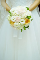 Bride holding wedding bouquet