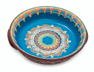 Traditional Bulgarian hand made, ornated, rich decorated, colorful painted ceramic dish isolated on white.