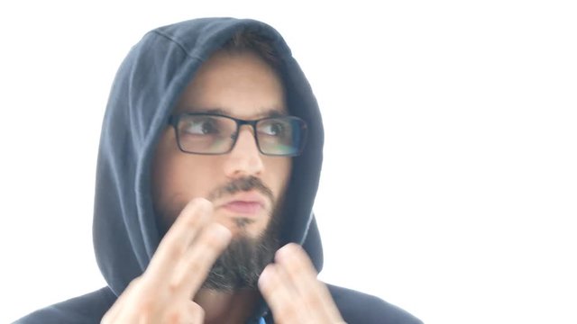 Closeup of self-confident bearded man in hoodie and eyeglasses dancing on contemporary electronic music, isolated on white background.