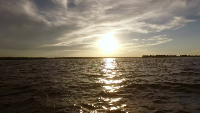 Scenic landscape. View on a riverbank from a boat riding on the river Volga. 4K