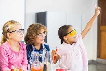 Obraz na płótnie Canvas Kids doing a chemical experiment in laboratory