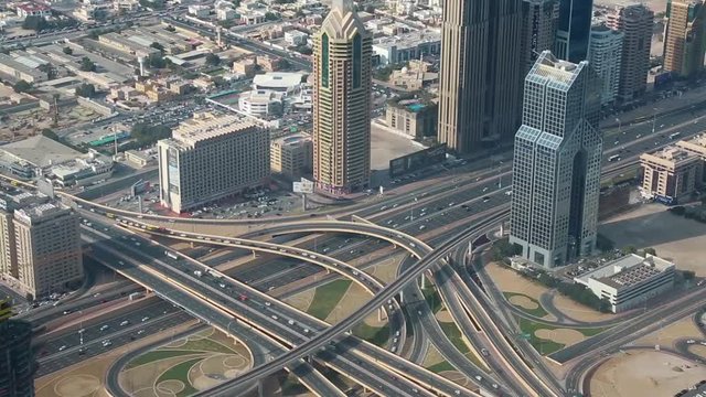 Dubai downtown traffic, United Arab Emirates. View on junction and Sheikh Zayed road from the 124th floor of Burj Khalifa skyscraper in Dubai, currently the tallest structure in the world, 829 m
