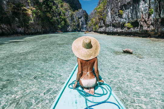 Woman travelling on the boat in Asia