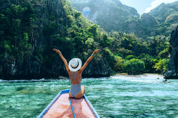 Woman travelling on the boat in Asia