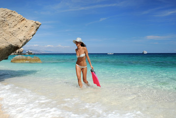 Fototapeta premium sensual woman in bikini with fins and diving mask