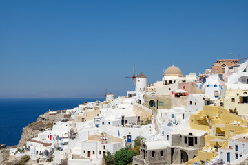 view with traditional white buildings over the village of Oia