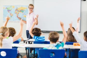 Teacher teaching kids in classroom