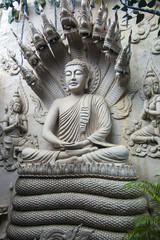 Obraz premium Meditating Buddha Statue on the wall. Vietnam