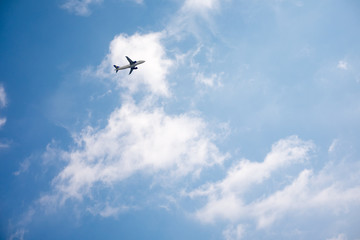 Airplane in the sky on kamari beach - 139129568